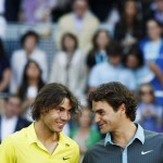 Spain's Nadal talks to Switzerland's Federer as they pose with their second and first place trophies at the end of their final match