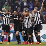 Juventus' players celebrate at the end of their Serie A soccer match against Sampdoria at the Marassi stadium in Genoa