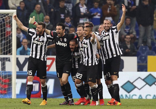Juventus' players celebrate at the end of their Serie A soccer match against Sampdoria at the Marassi stadium in Genoa