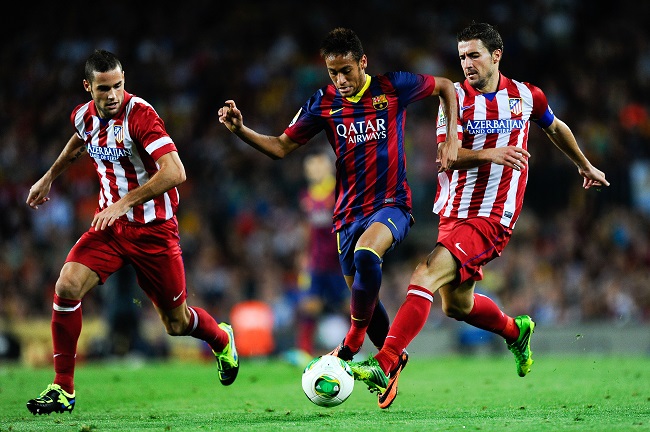 BARCELONA, SPAIN - AUGUST 28: Neymar (C) of FC Barcelona duels for the ball with Mario Suarez (R) and Gabi Fernandez of Atletico de Madrid during the Spanish Super Cup second leg match between FC Barcelona and Atletico de Madrid at Nou Camp on August 28, 2013 in Barcelona, Spain. (Photo by David Ramos/Getty Images)